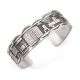 SILVER STORYTELLER BRACELET BY ROLAND BEGAY (NAVAJO)